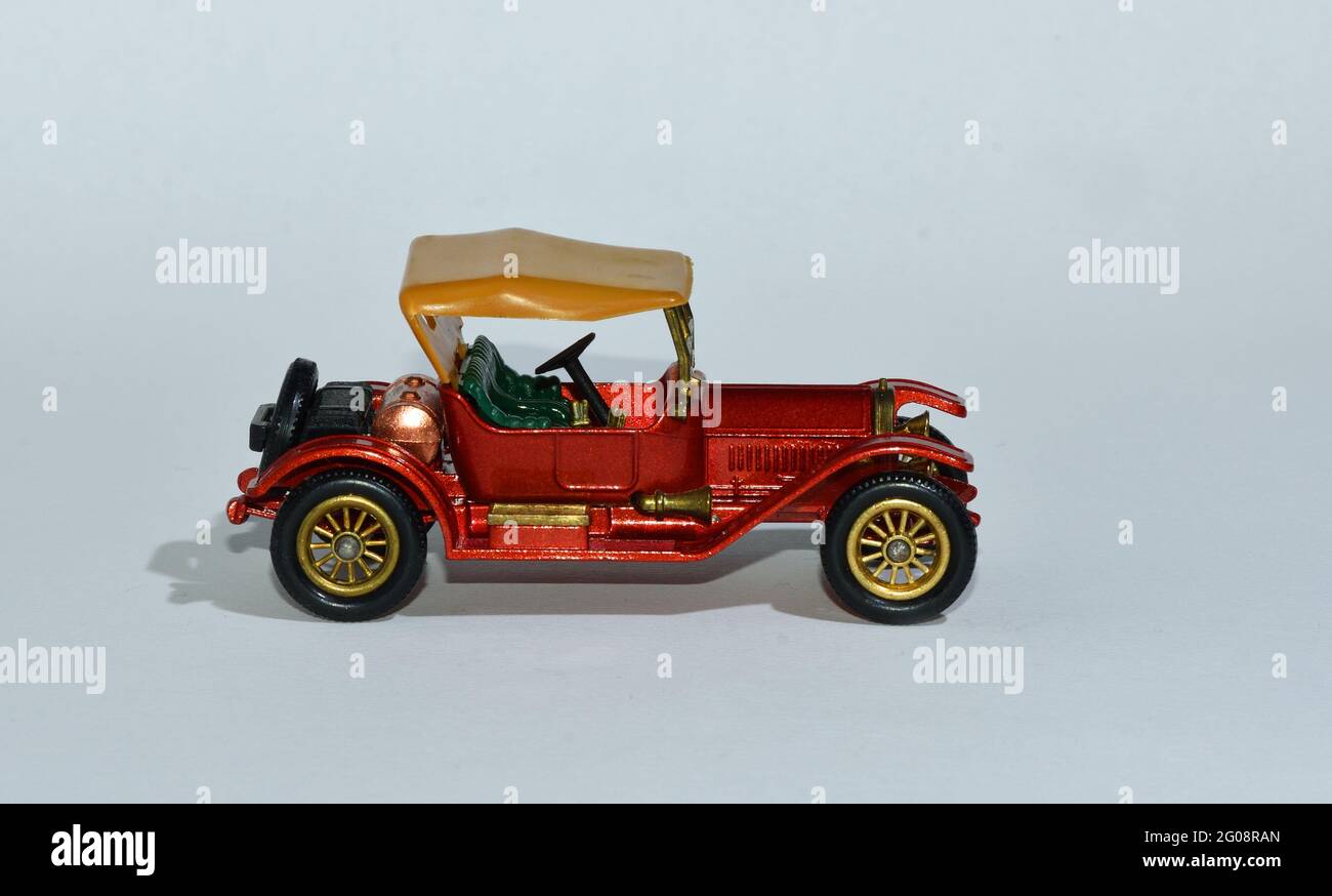 Toy diecast model of a Red 1937 Stutz a Matchbox yesteryear product by Lesney with white background Stock Photo