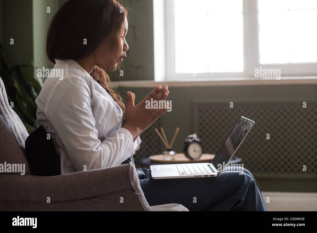 telehealth with virtual afro American doctor appointment and online therapy session. Black doctor online conference Stock Photo