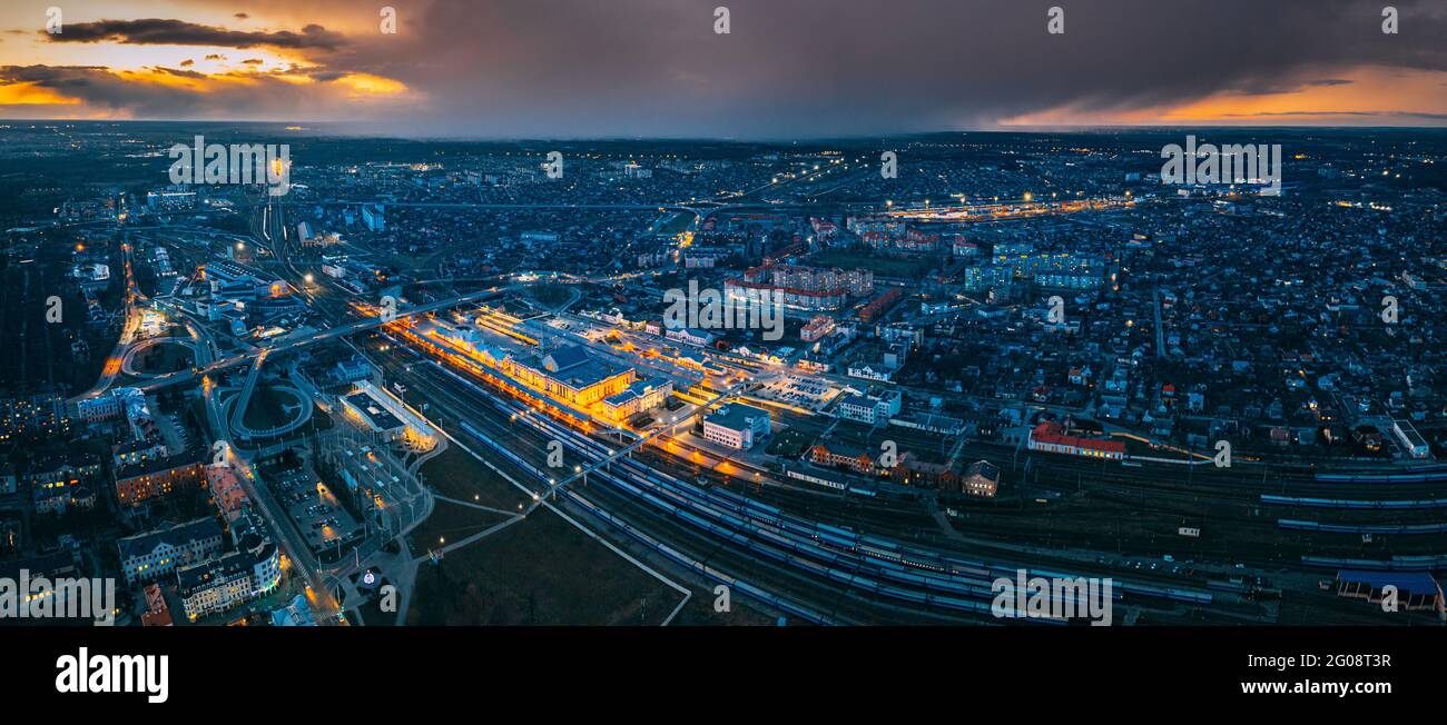 Brest, Belarus. Aerial Bird's-eye View Of Cityscape Skyline. Night Aerial View Of Railway Station. Panorama, Panoramic View Stock Photo