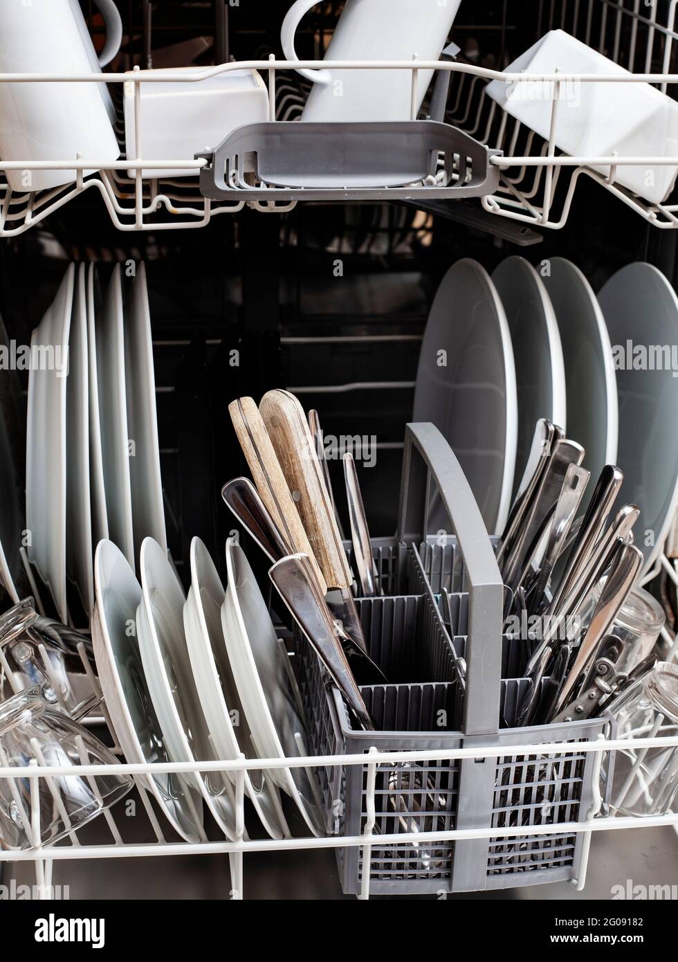 dishes in dishwasher Stock Photo