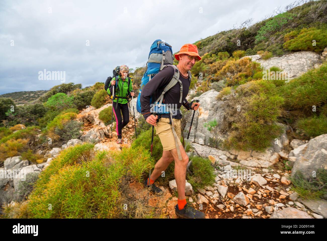 Group of backpackers hiking in mountains outdoor active lifestyle ...