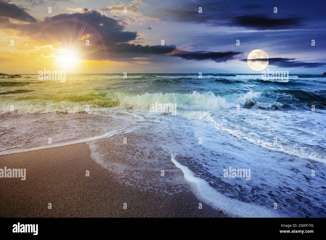 day and night time change concept above sea tide on a cloudy twilight. green waves crashing golden sandy beach with sun and moon above the horizon. st Stock Photo