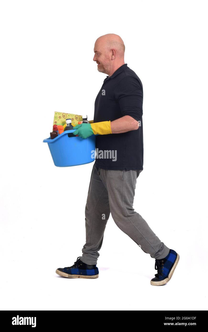 man walking with a bucket and cleaning supplies on white background