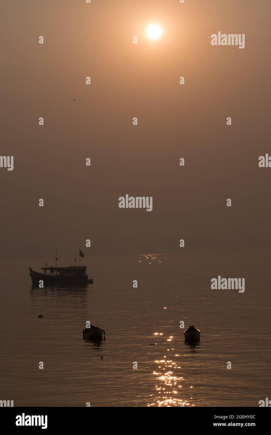 Killeshwar Sihouette of boat sailing in Mumbai beach at killeshwar temple at madh ...