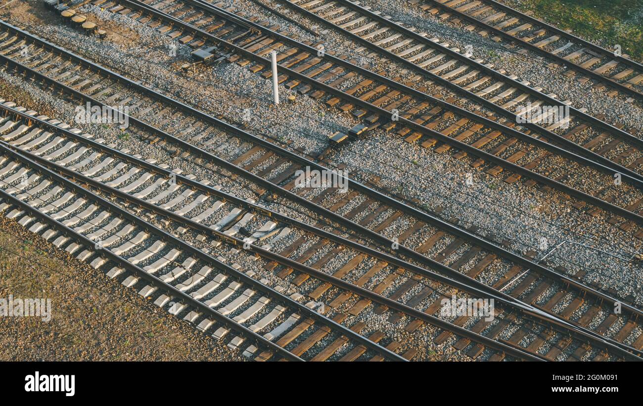 Railway junction with many train tracks near railway station in city