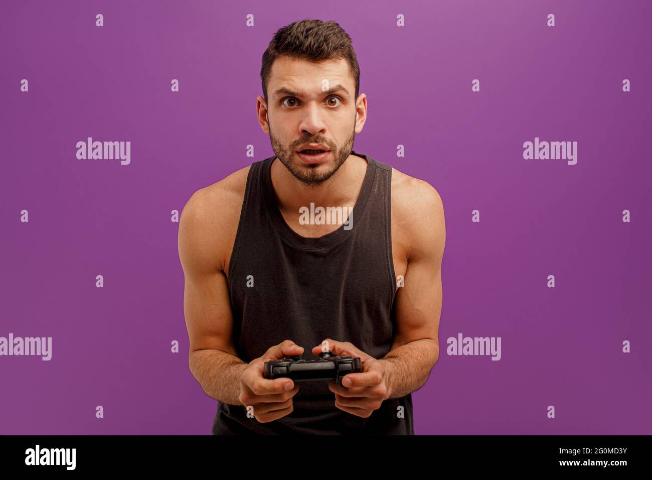 Concentrated man play video game on joystick Stock Photo