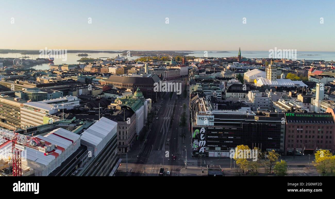HELSINKI, FINLAND - May 23, 2020: Aerial view overlooking the quiet Mannerheimintie street and the downtown of Helsinki, sunny, summer morning sunrise Stock Photo