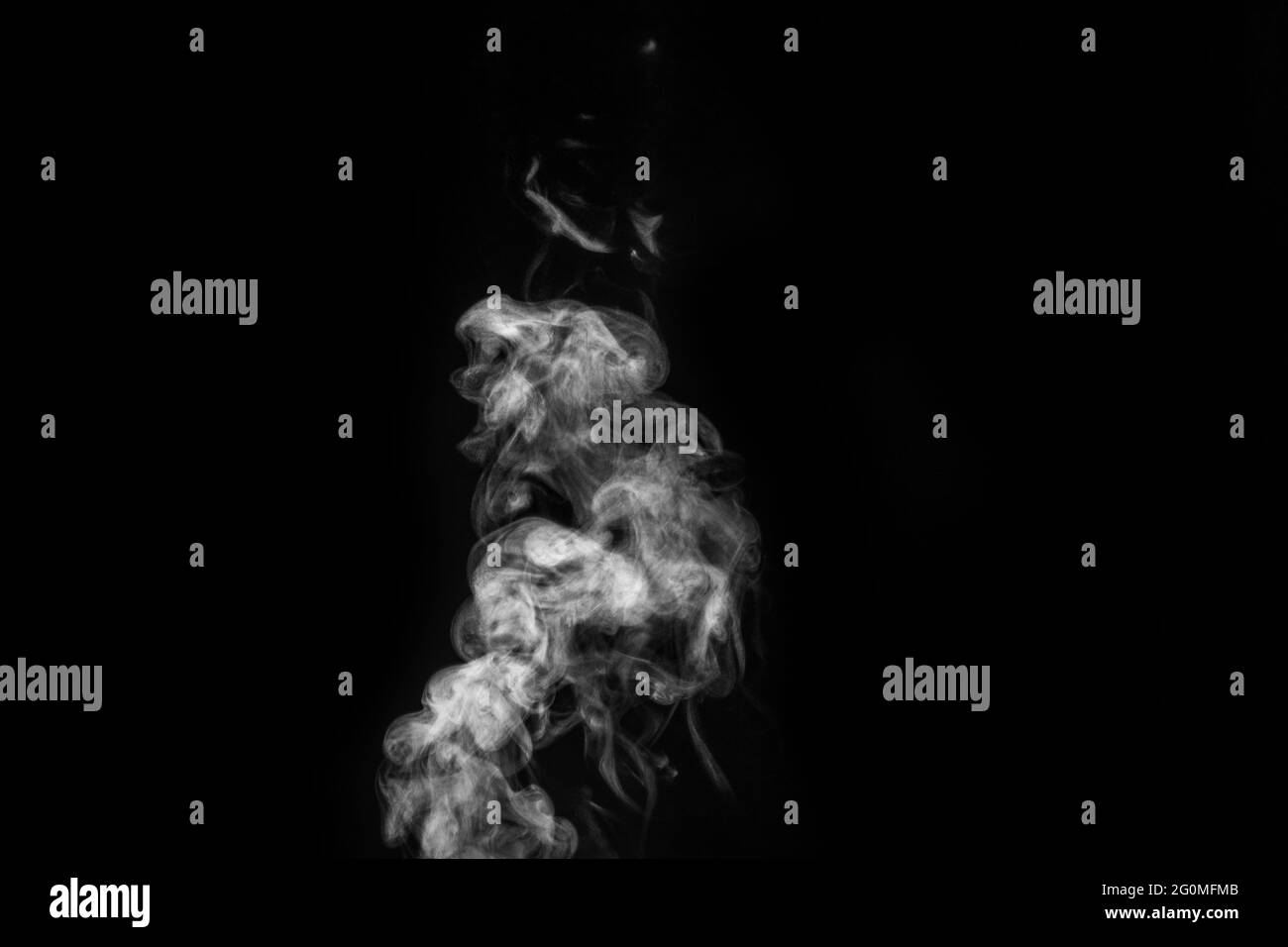 Smoke fragments on a black background. Abstract background, design element, for overlay on pictures. Stock Photo