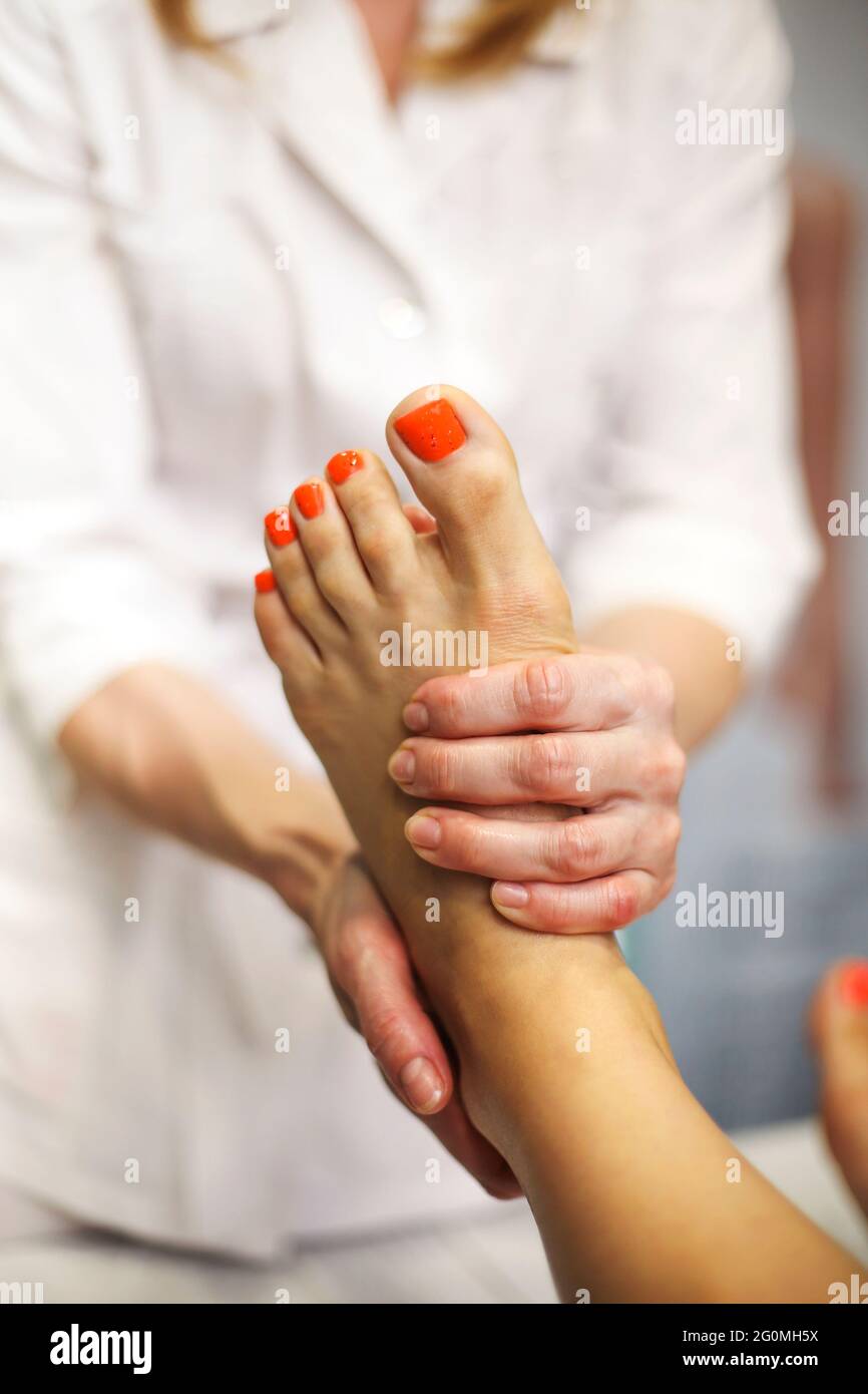 Foot massage, spa foot treatment Stock Photo Alamy