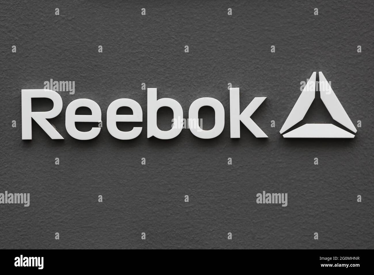 Copenhagen, Denmark - August 20, 2020: Reebok logo on a wall. Reebok is a global athletic footwear and apparel company Stock Photo
