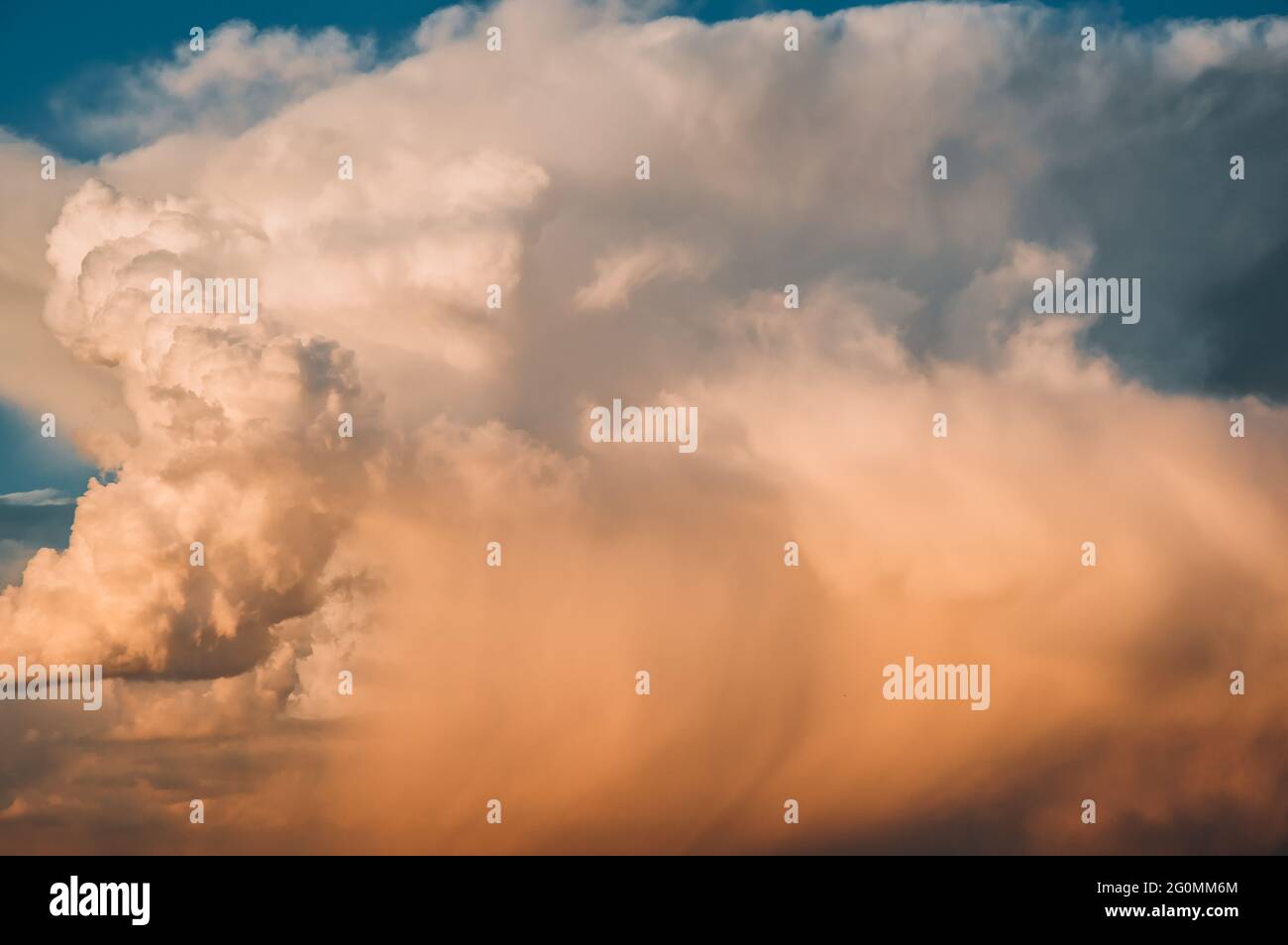 Colored air clouds in the sunset sky Stock Photo