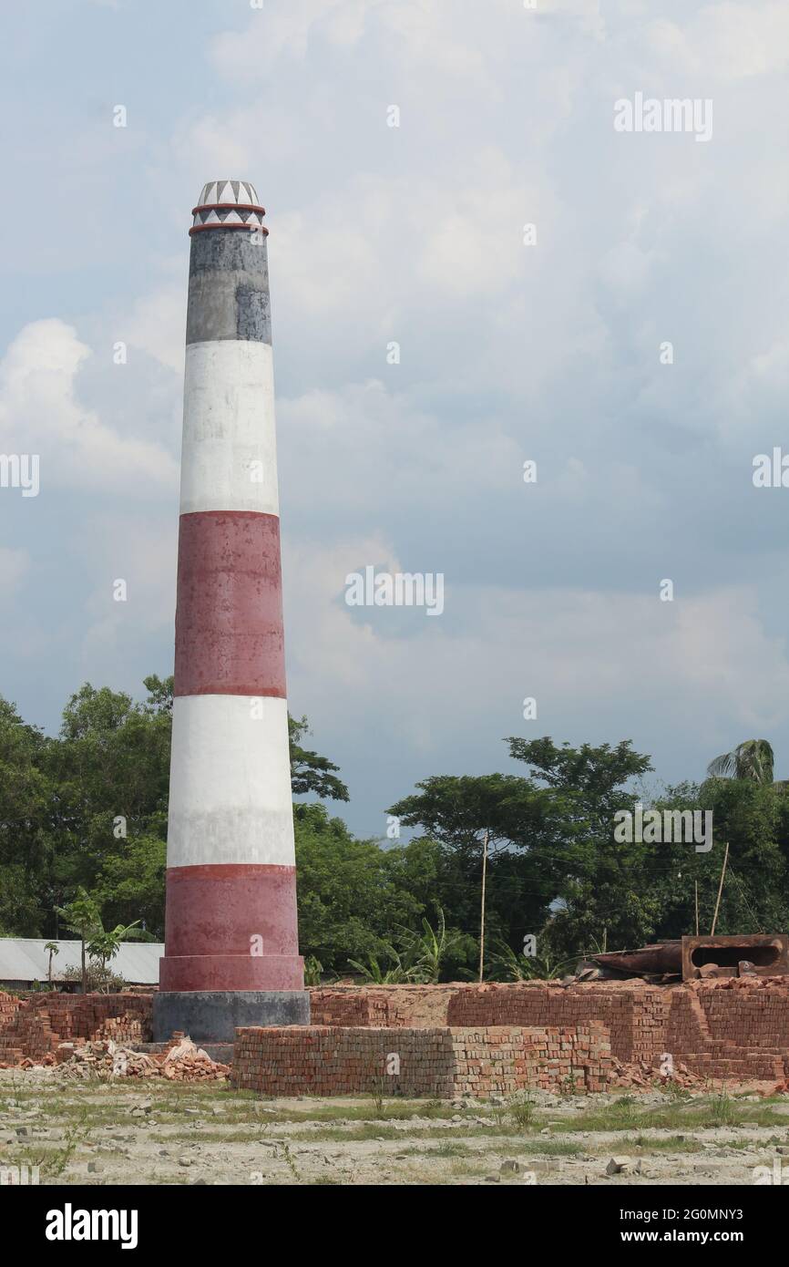A brick kiln in a field at a remote location in Bangladesh. It is used to produce bricks. Stock Photo