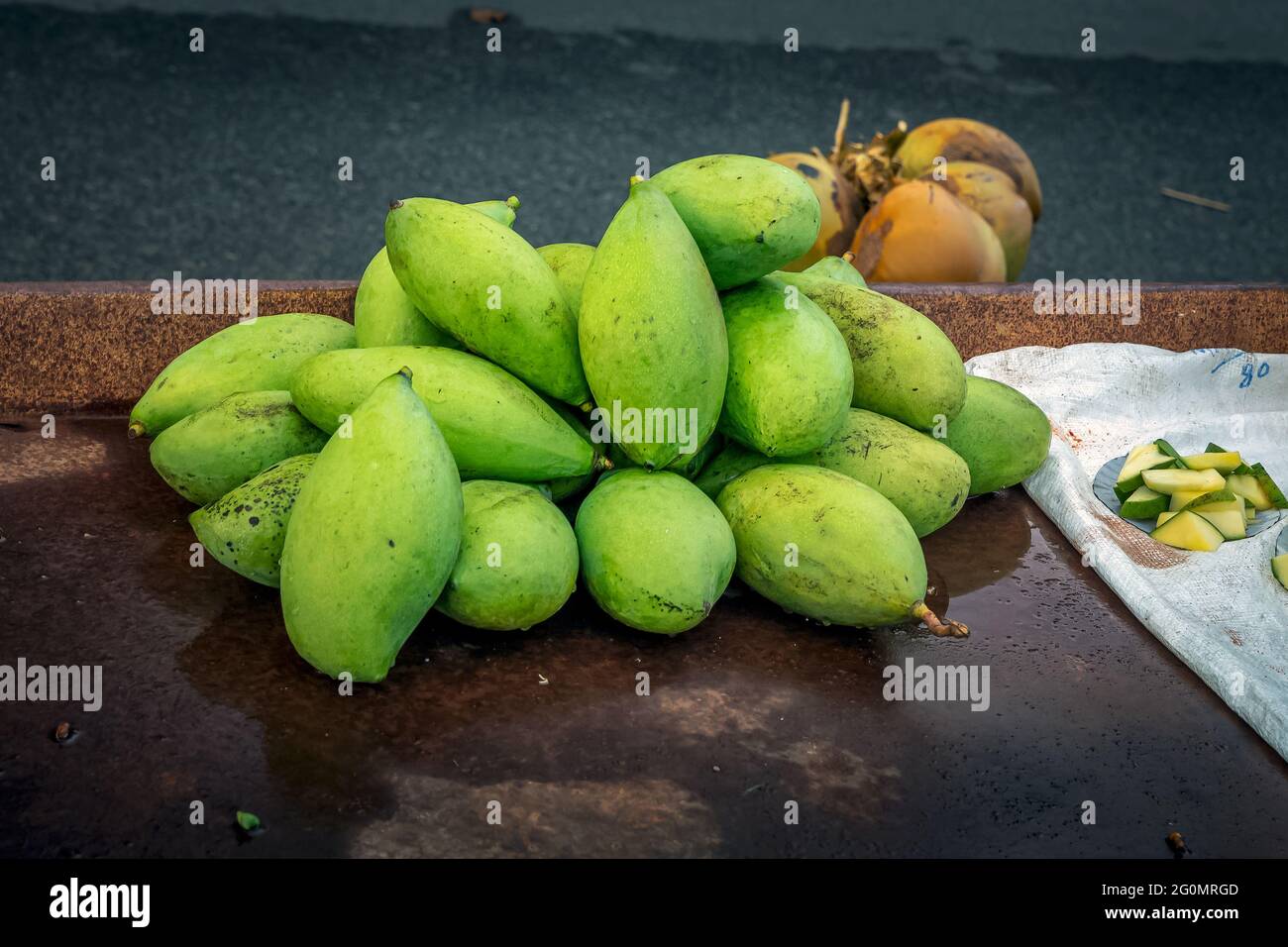 Raw green Mango for selling at Kanyakumari beach. Tamilnadu India Stock