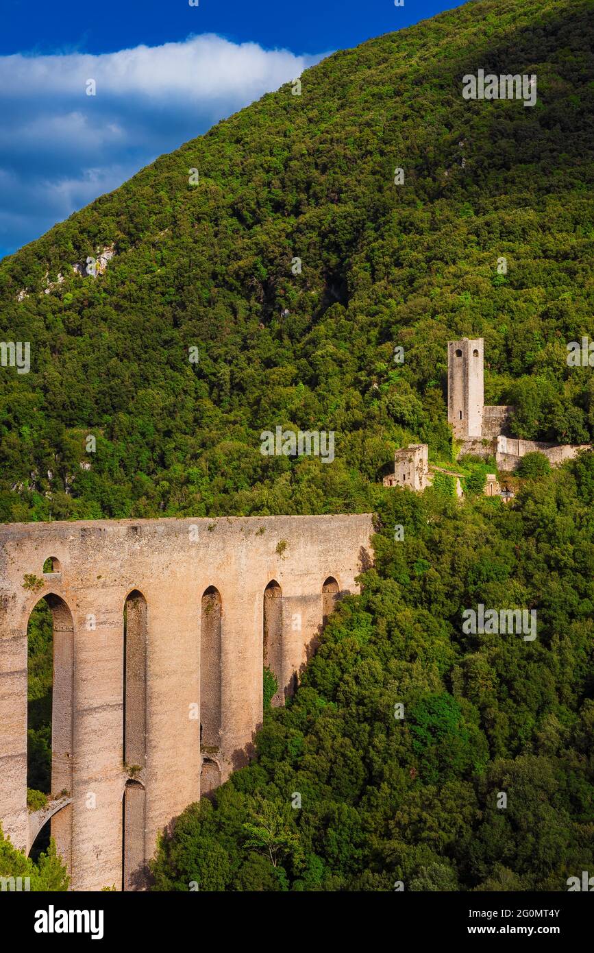Ancient medieval Ponte delle Torri (Tower Bridge) ruins in Spoleto among woods Stock Photo
