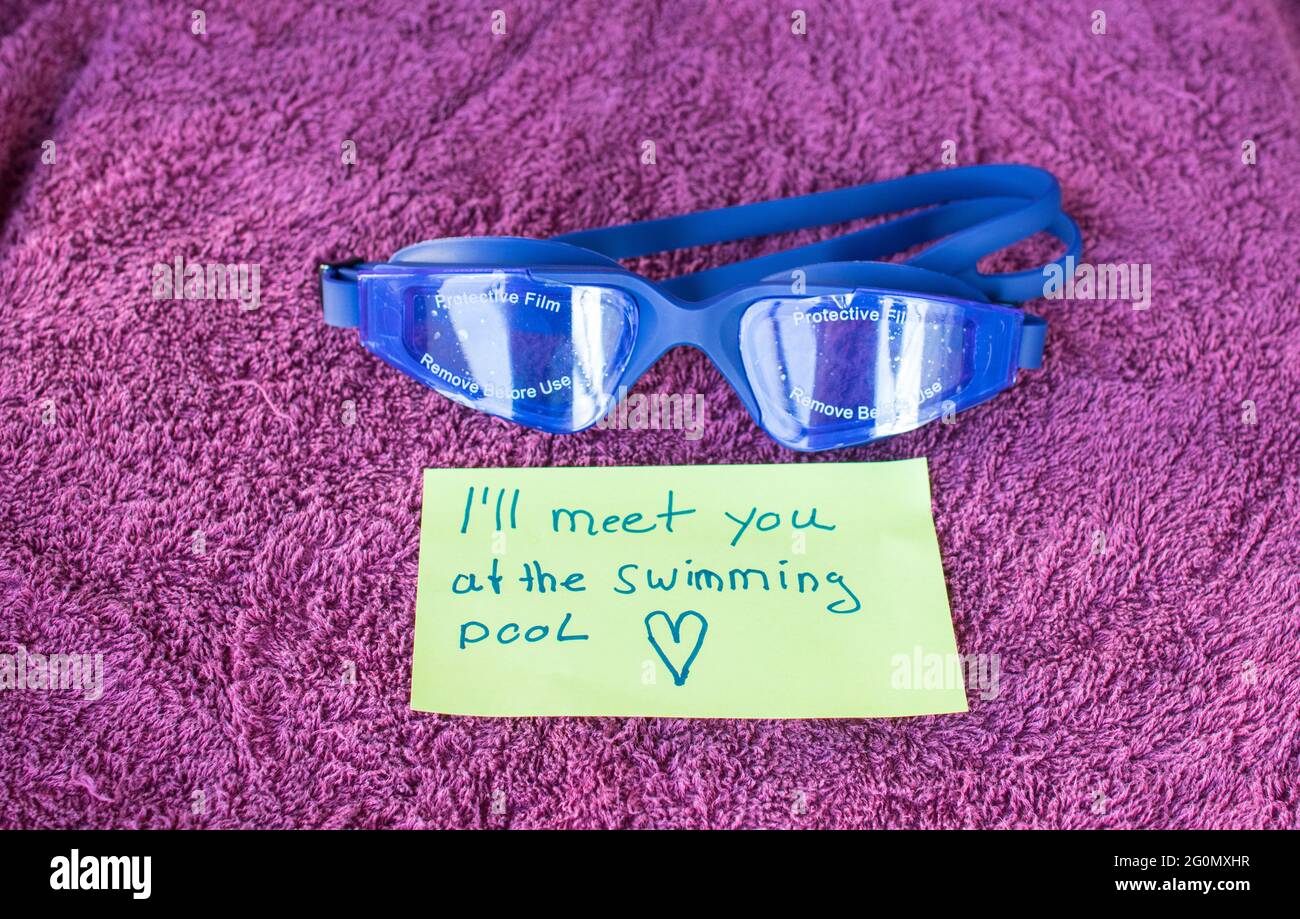 swimming goggles on a bath towel Stock Photo