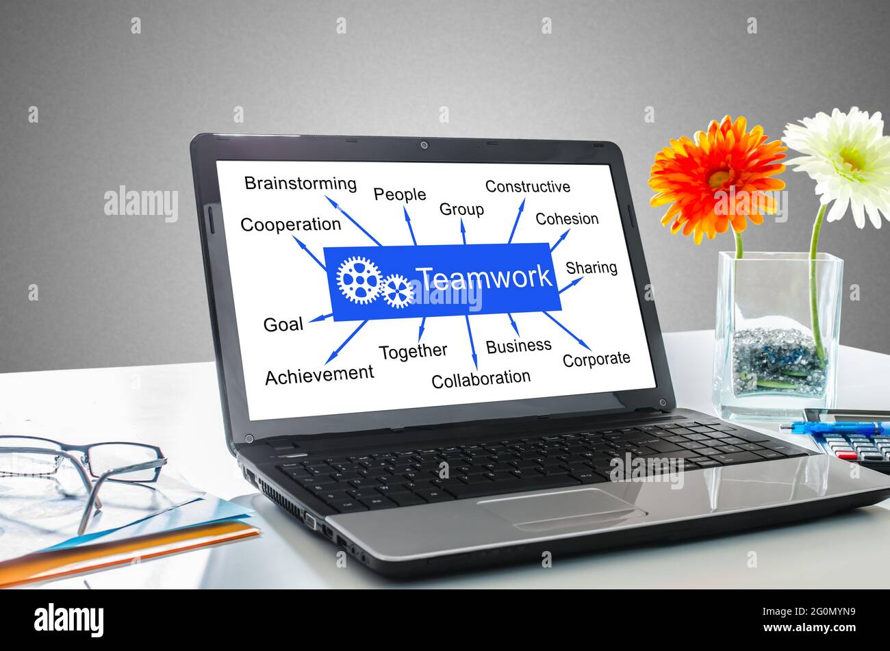 Laptop screen showing teamwork concept Stock Photo - Alamy