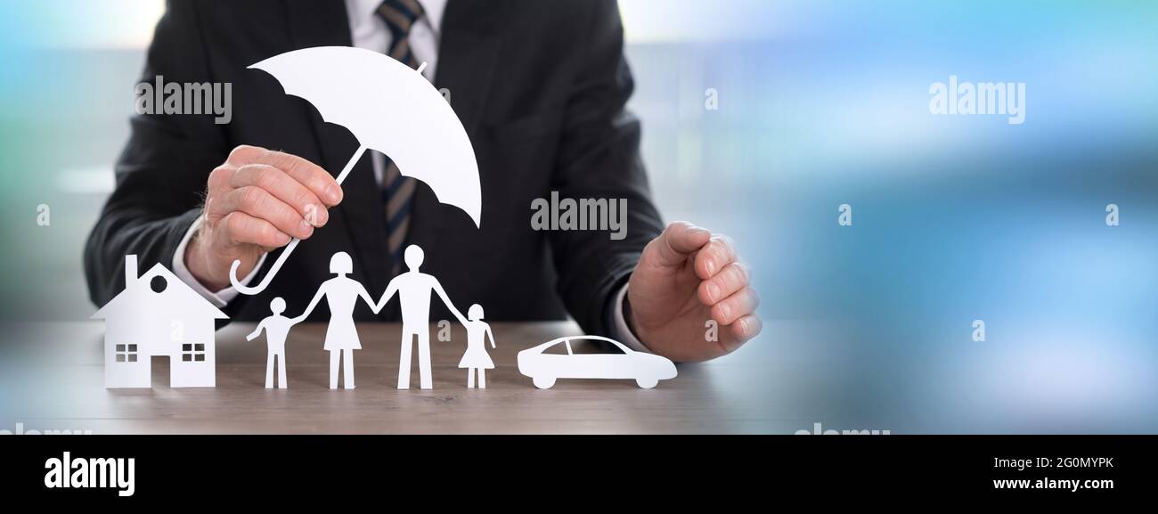Insurer protecting a house, a family and a car Stock Photo