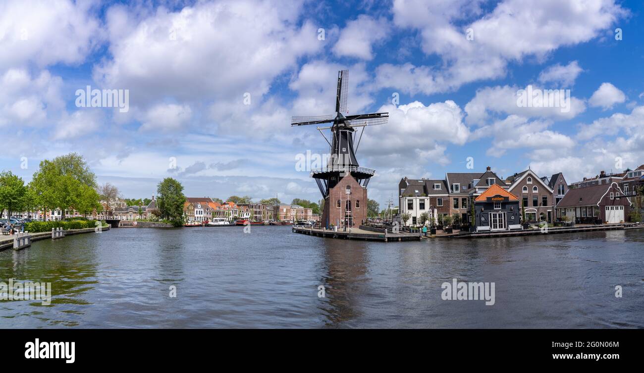 Haarlem, Netherlands - 21 May, 2021: panorama view of the Dee Adrian Windmill and Binnen Spaarne River in Haarlem Stock Photo