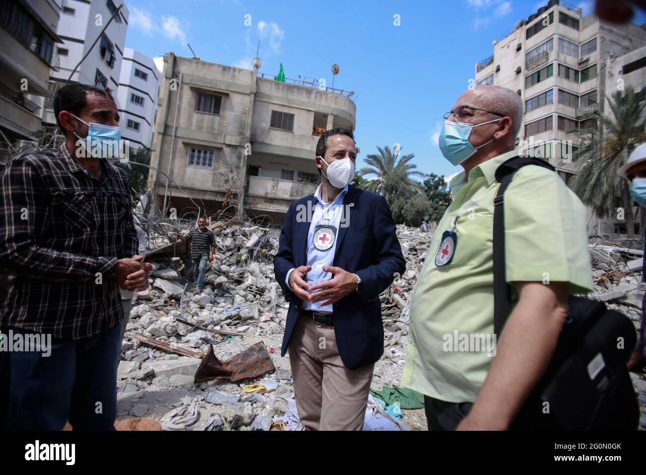 Robert Mardini (Navy blue Jacket), Director General of the International  Committee of the Red Cross (ICRC) along with his team speak to Al Wehda  resident whose home was destroyed in the Israel