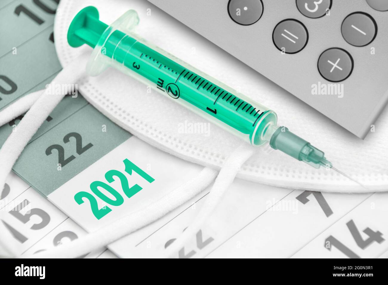 Calendar 2021 FFP2 Mask and Vaccination with calculator Stock Photo