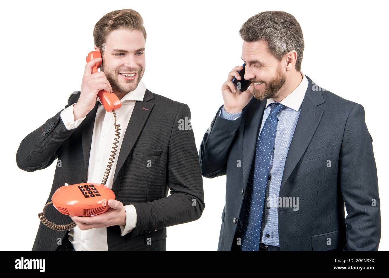 Happy entrepreneurs answer mobile phone and telephone call isolated on whiite, calling Stock Photo