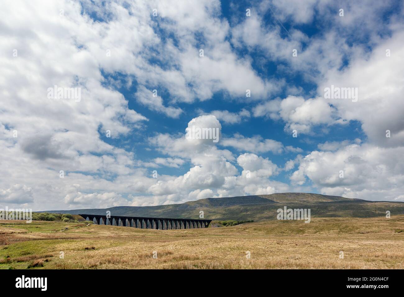 Stunning panoramic view of Whernside with the Ribblehead Viaduct on a sunny day, Yorkshire Dales National Park, UK Stock Photo