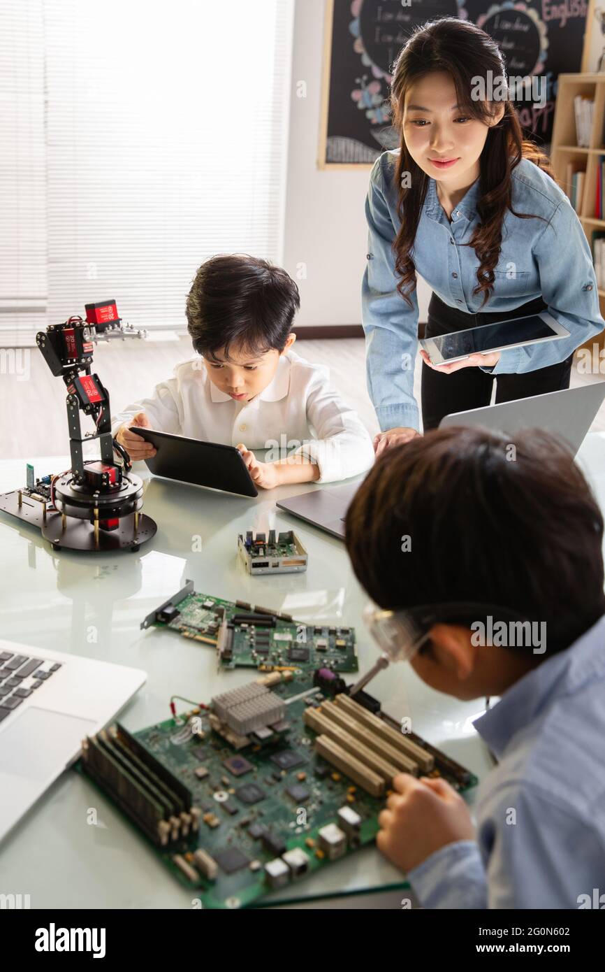 Students learning robot programming Stock Photo - Alamy