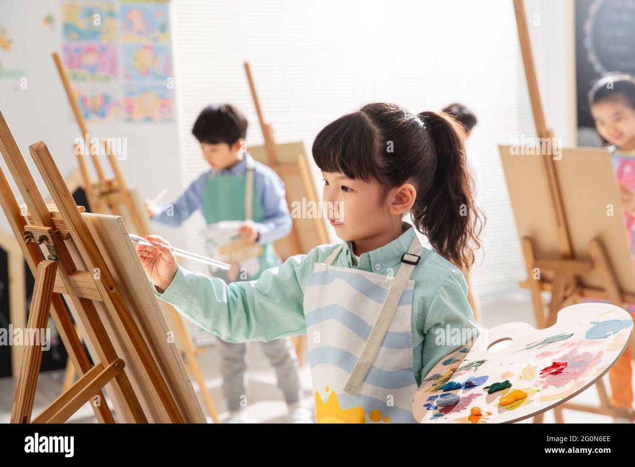 Children learning to paint Stock Photo Alamy
