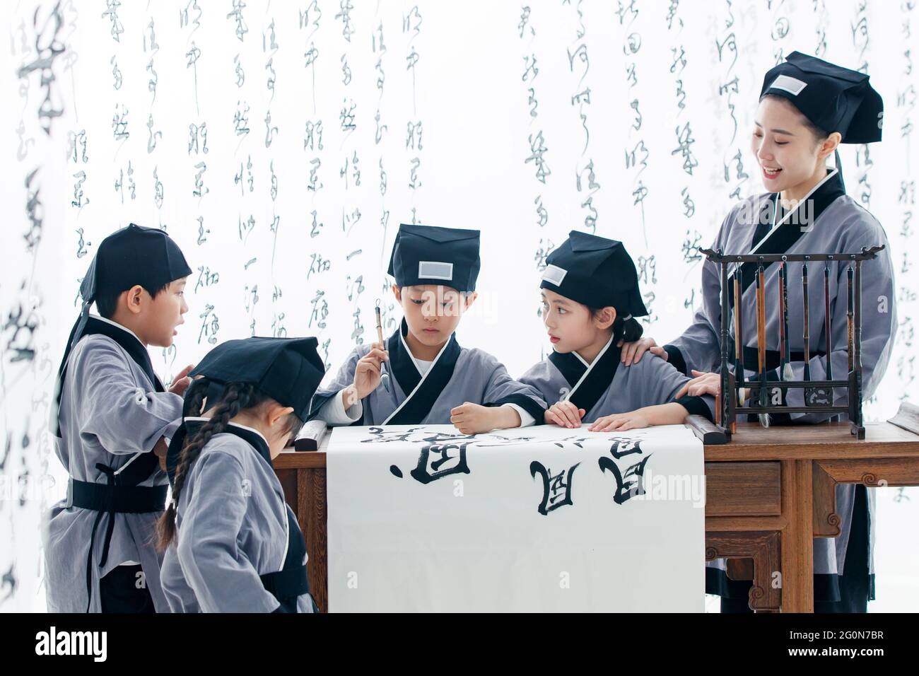 The teacher taught the pupils to learn calligraphy Stock Photo - Alamy