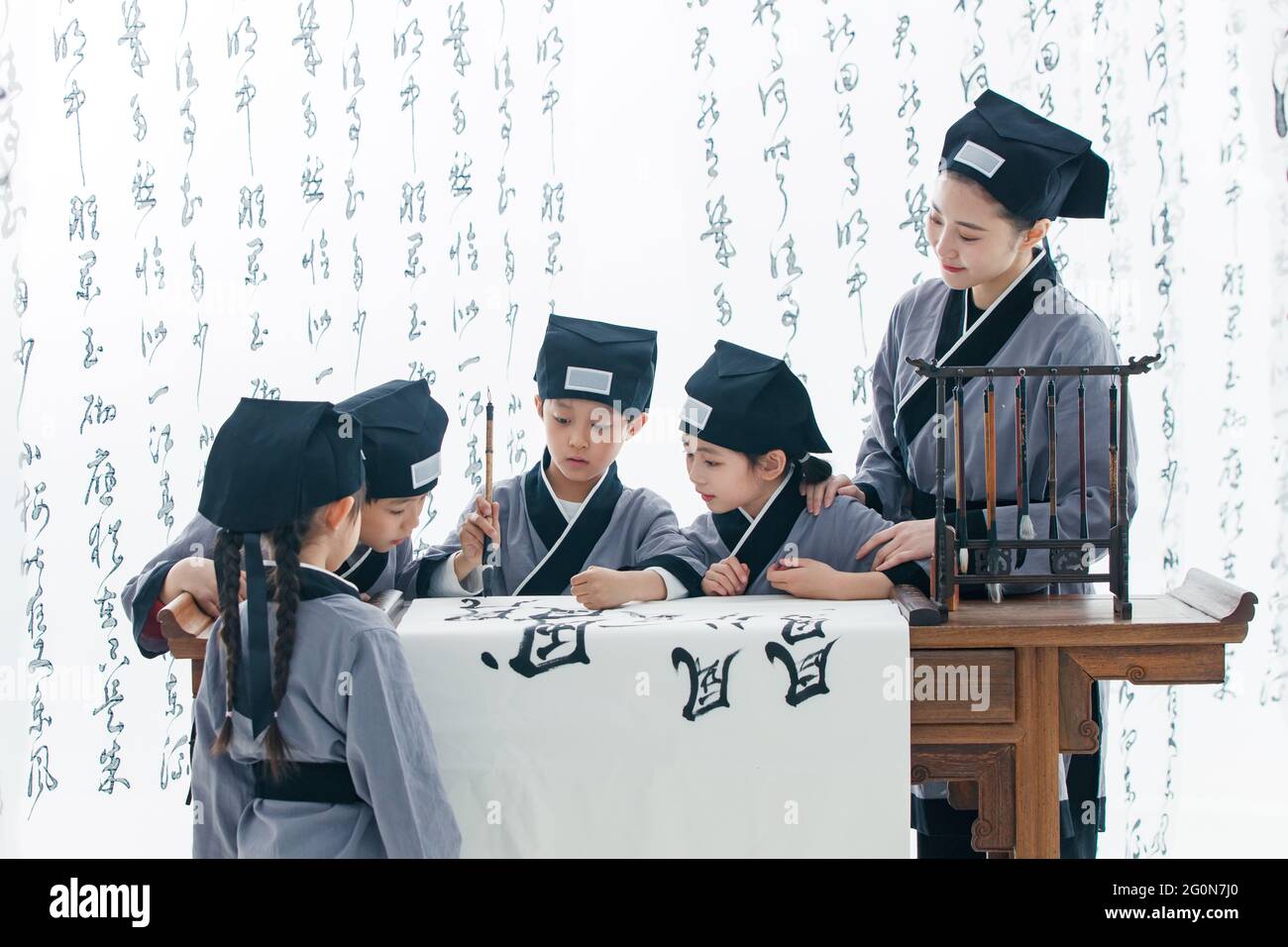 The teacher taught the pupils to learn calligraphy Stock Photo - Alamy