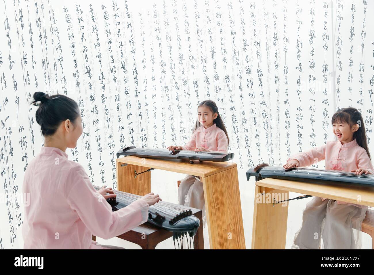 The youth teacher taught the pupils learn guzheng Stock Photo Alamy