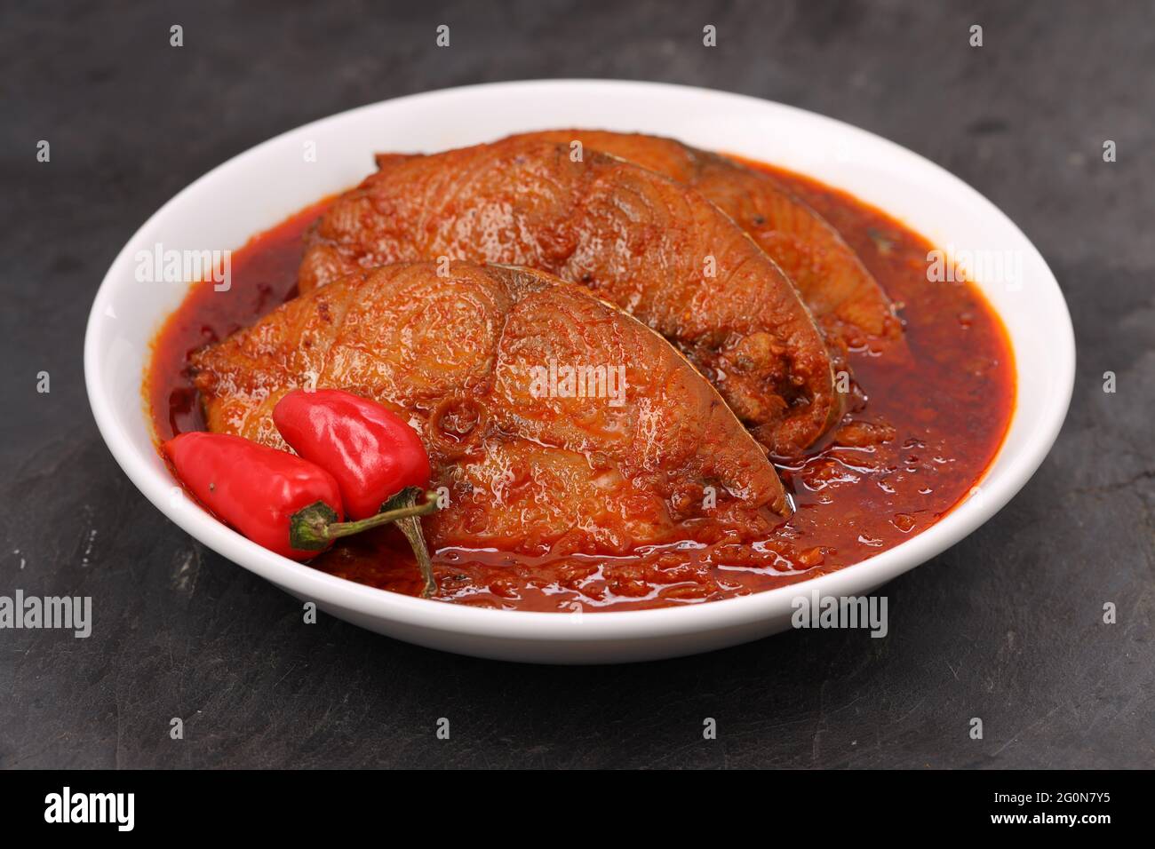 Seer Fish curry, traditional Indian fish curry ,arranged in a white