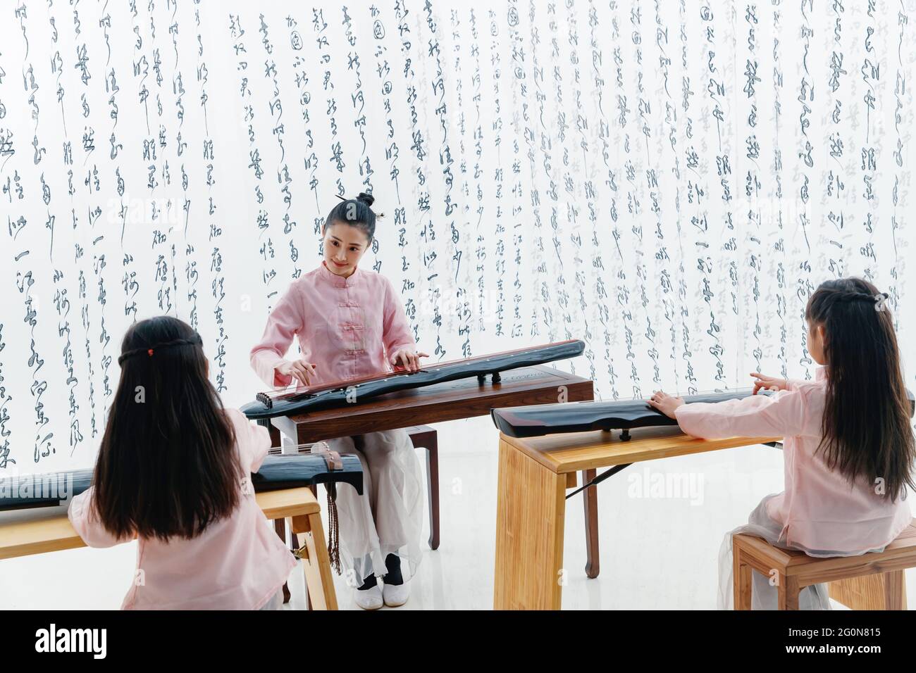 The youth teacher taught the pupils learn guzheng Stock Photo Alamy