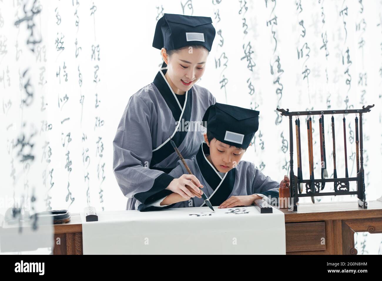 The teacher taught the pupils to learn calligraphy Stock Photo - Alamy