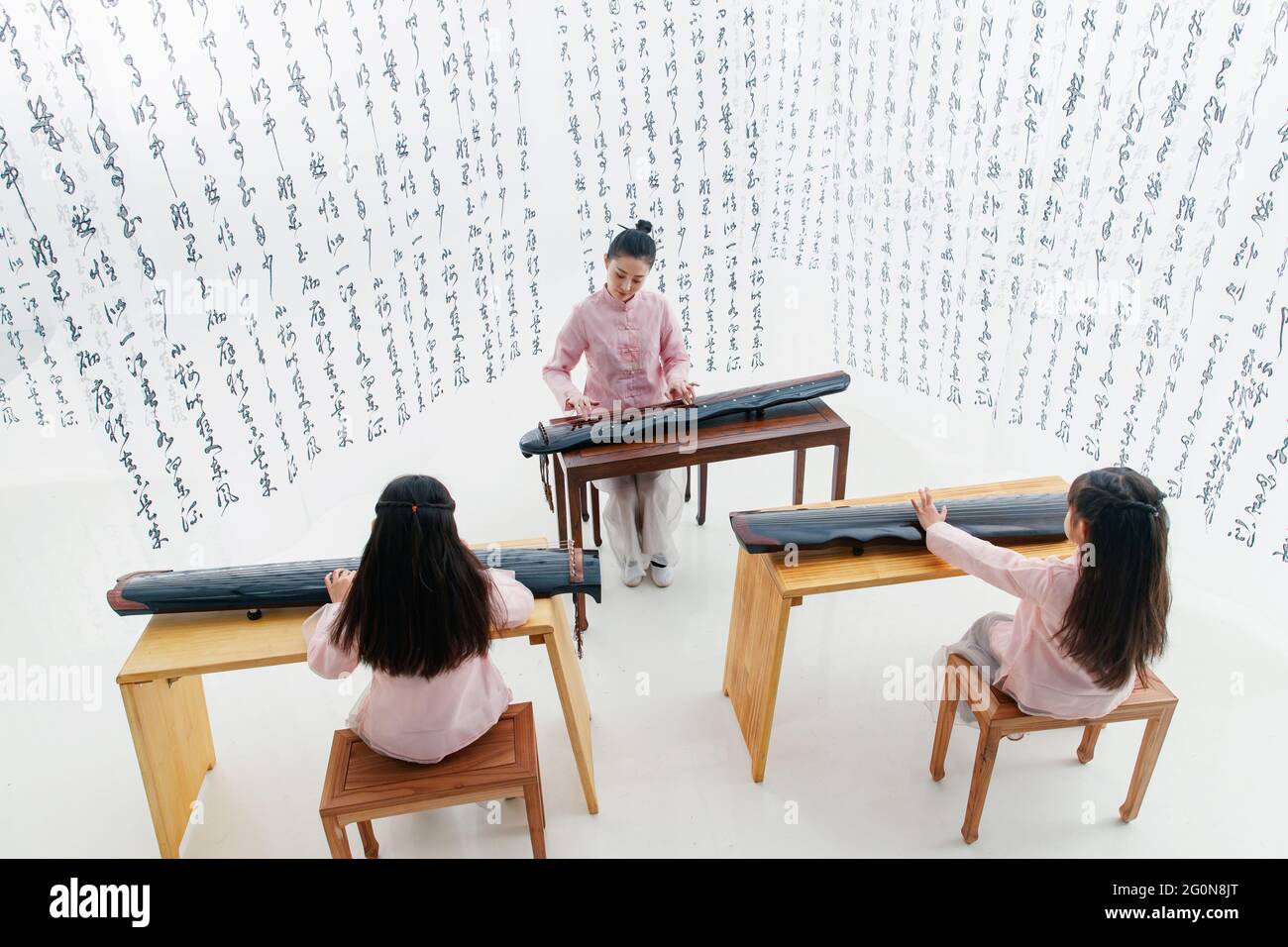 The youth teacher taught the pupils learn guzheng Stock Photo Alamy