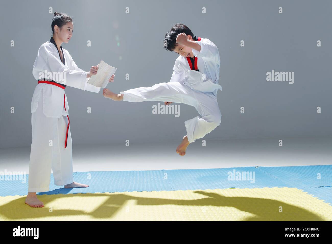 Young coach taught the little boy learn tae kwon do Stock Photo Alamy