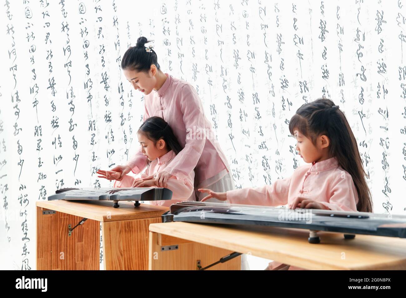 The youth teacher taught the pupils learn guzheng Stock Photo Alamy