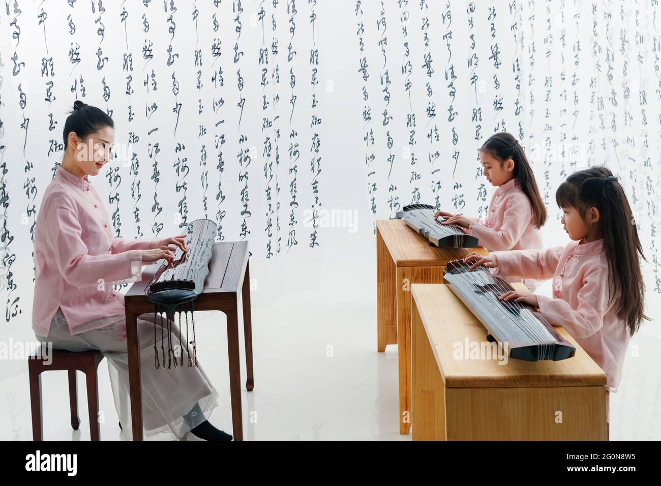 The youth teacher taught the pupils learn guzheng Stock Photo Alamy