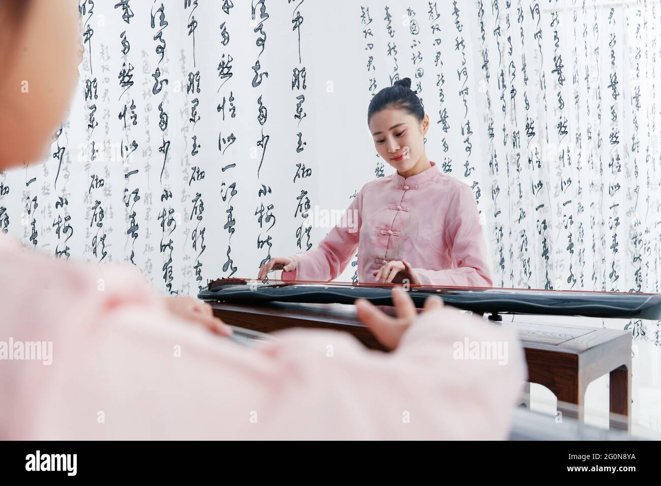 The youth teacher taught the pupils learn guzheng Stock Photo Alamy