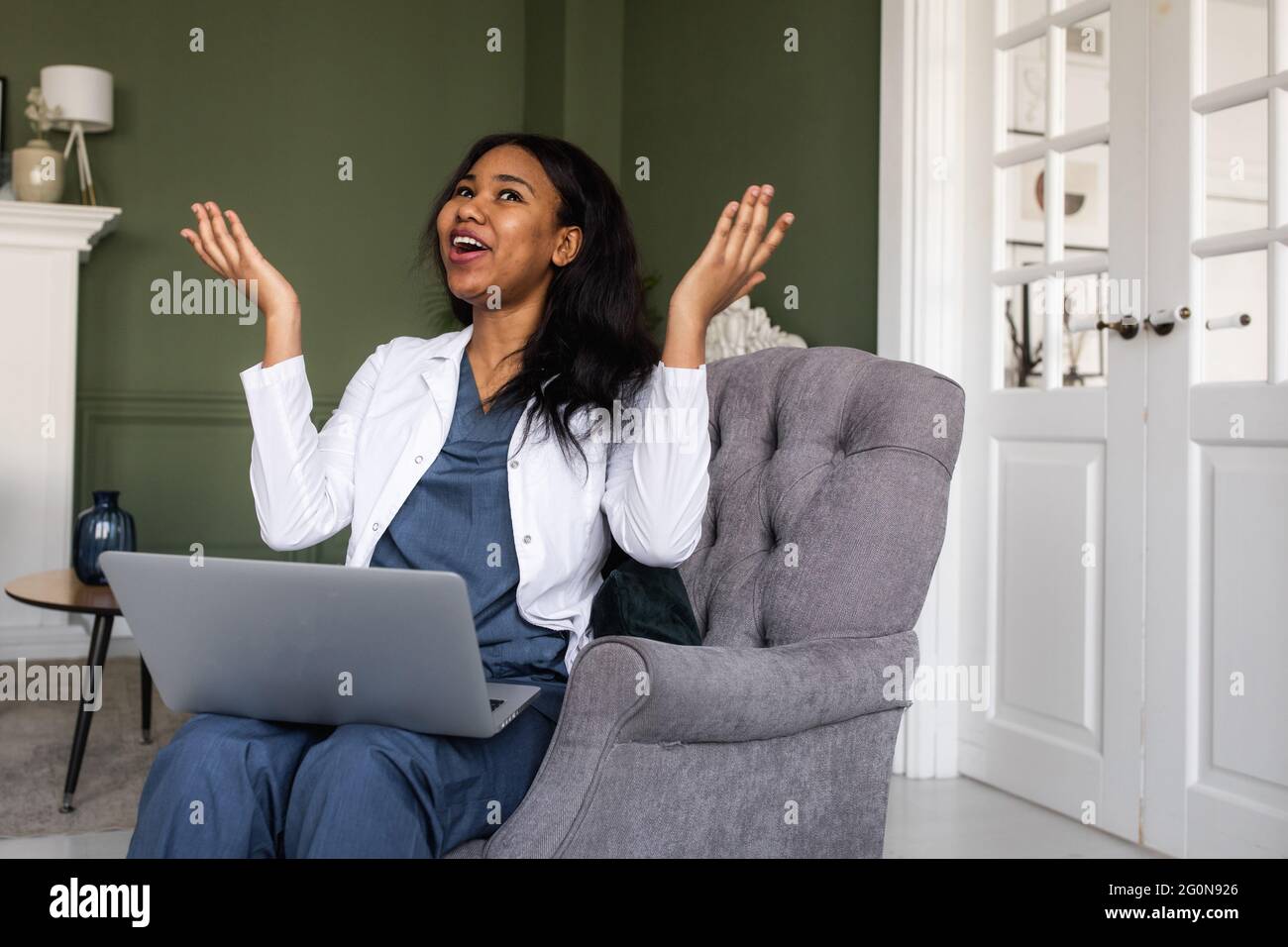 telehealth with virtual afro American doctor appointment and online therapy session. Black doctor online conference Stock Photo