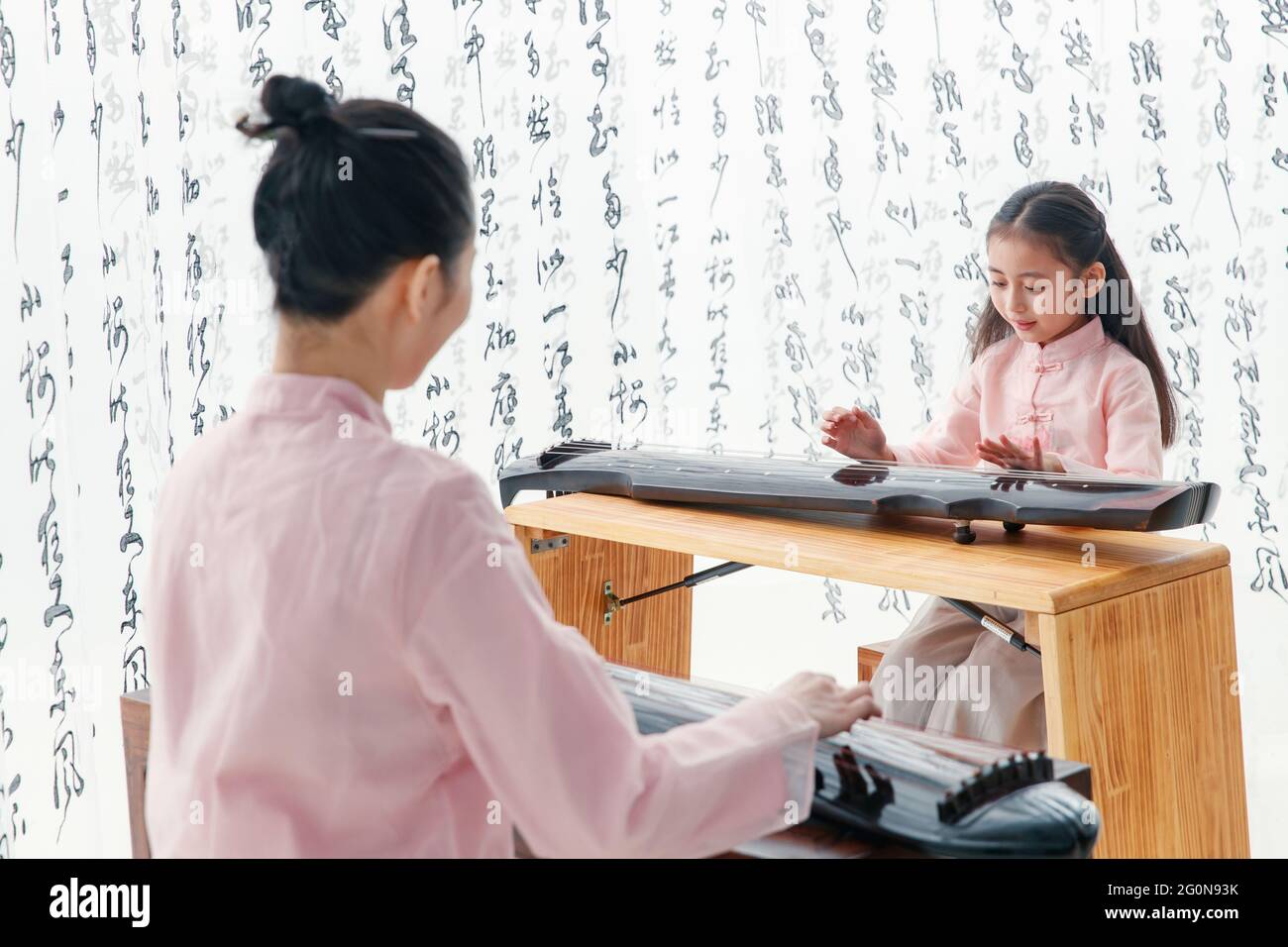 The youth teacher taught the pupils learn guzheng Stock Photo Alamy