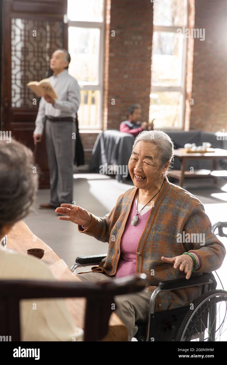 Happy old people come together to chat Stock Photo