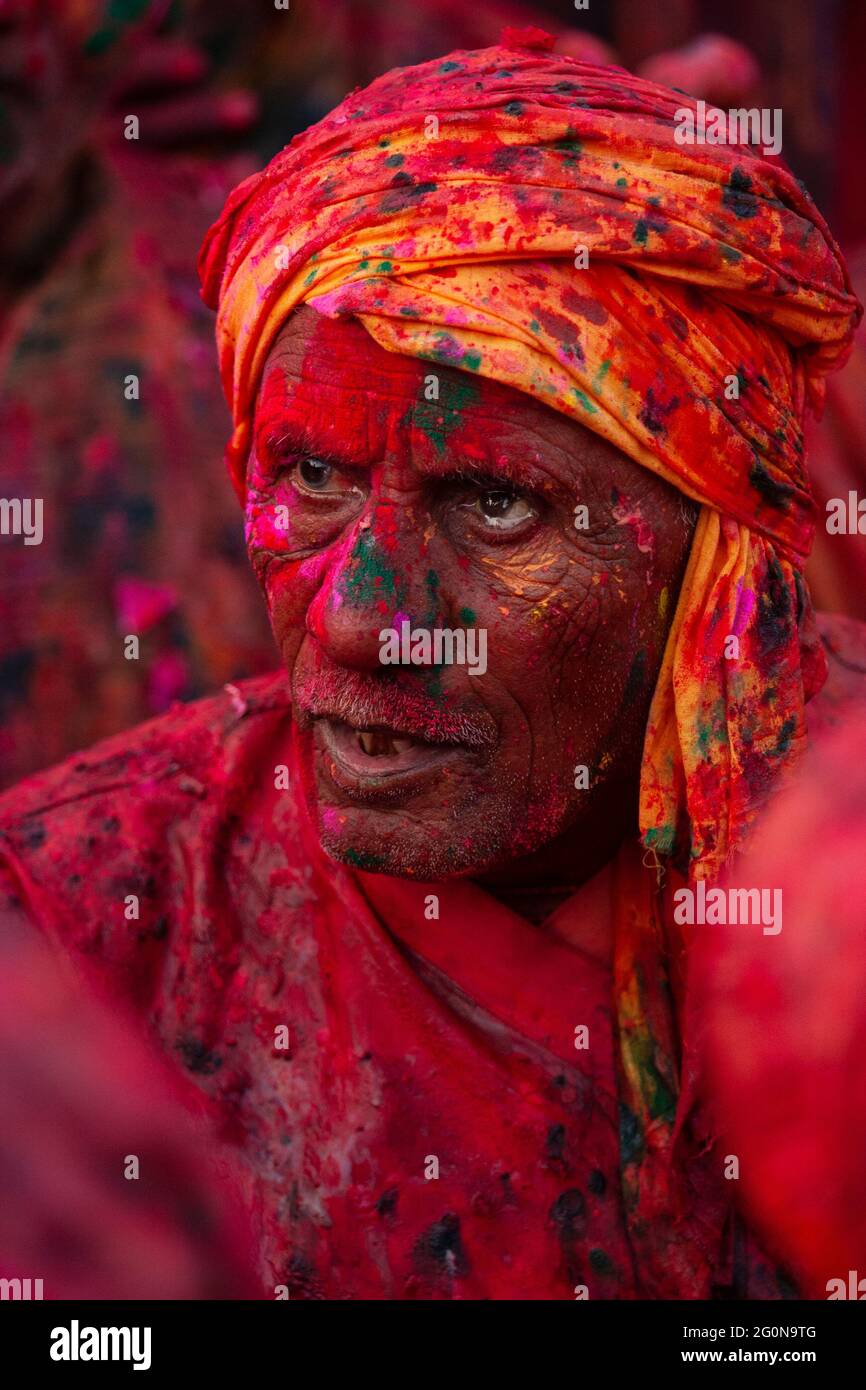 Indian man face smudged with multicolour in Holi festival Stock Photo