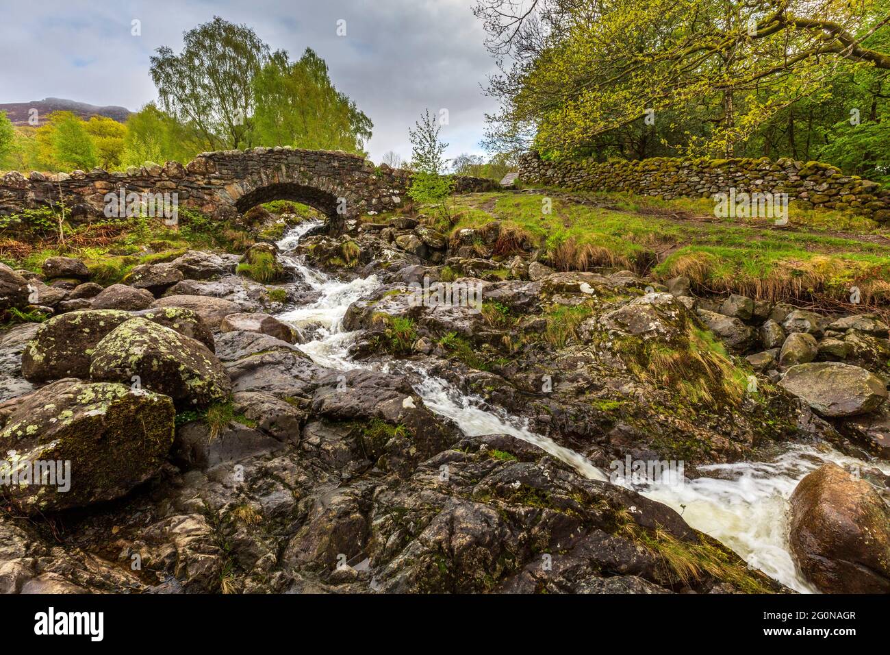 Looking upstream to Ashness Bridge, Lake District, England Stock Photo