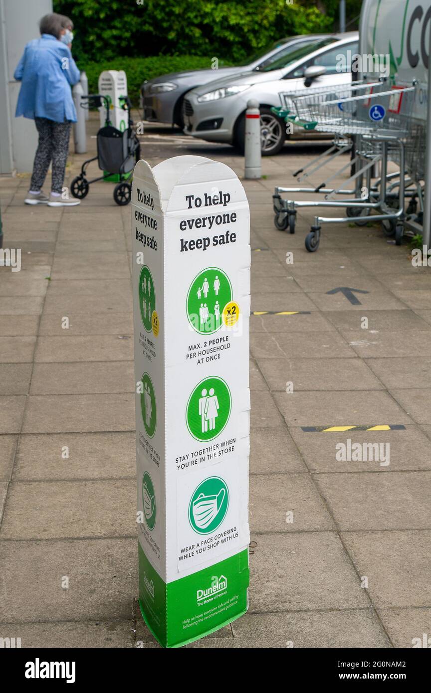 Slough, Berkshire, UK. 2nd June, 2021. Social distancing signs outside the Dunelm store in Slough. Homeware company Dunelm have seen sales growth at a  “very strong” level since it's stores reopened from 12 April 2021. Credit: Maureen McLean/Alamy Stock Photo