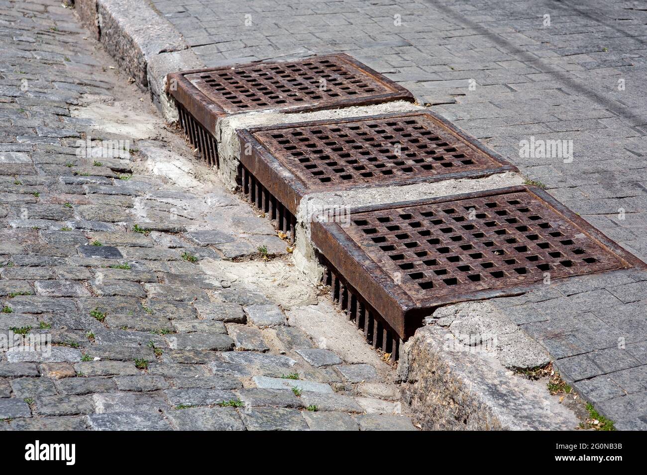 drainage system of urban infrastructure with an iron grating of the