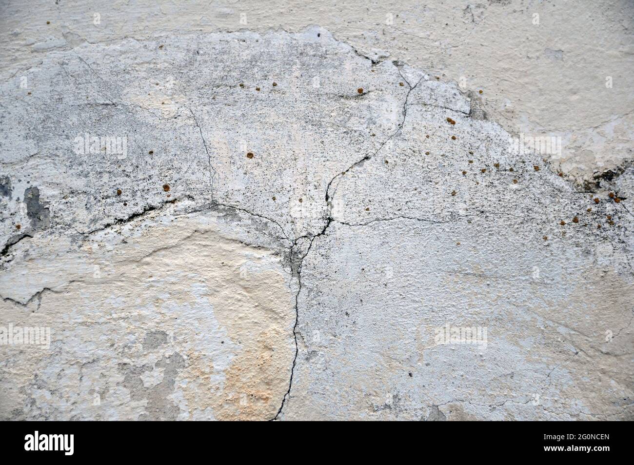 Empty old plastered wall texture. Painted problem wall surface. Crack. Stock Photo