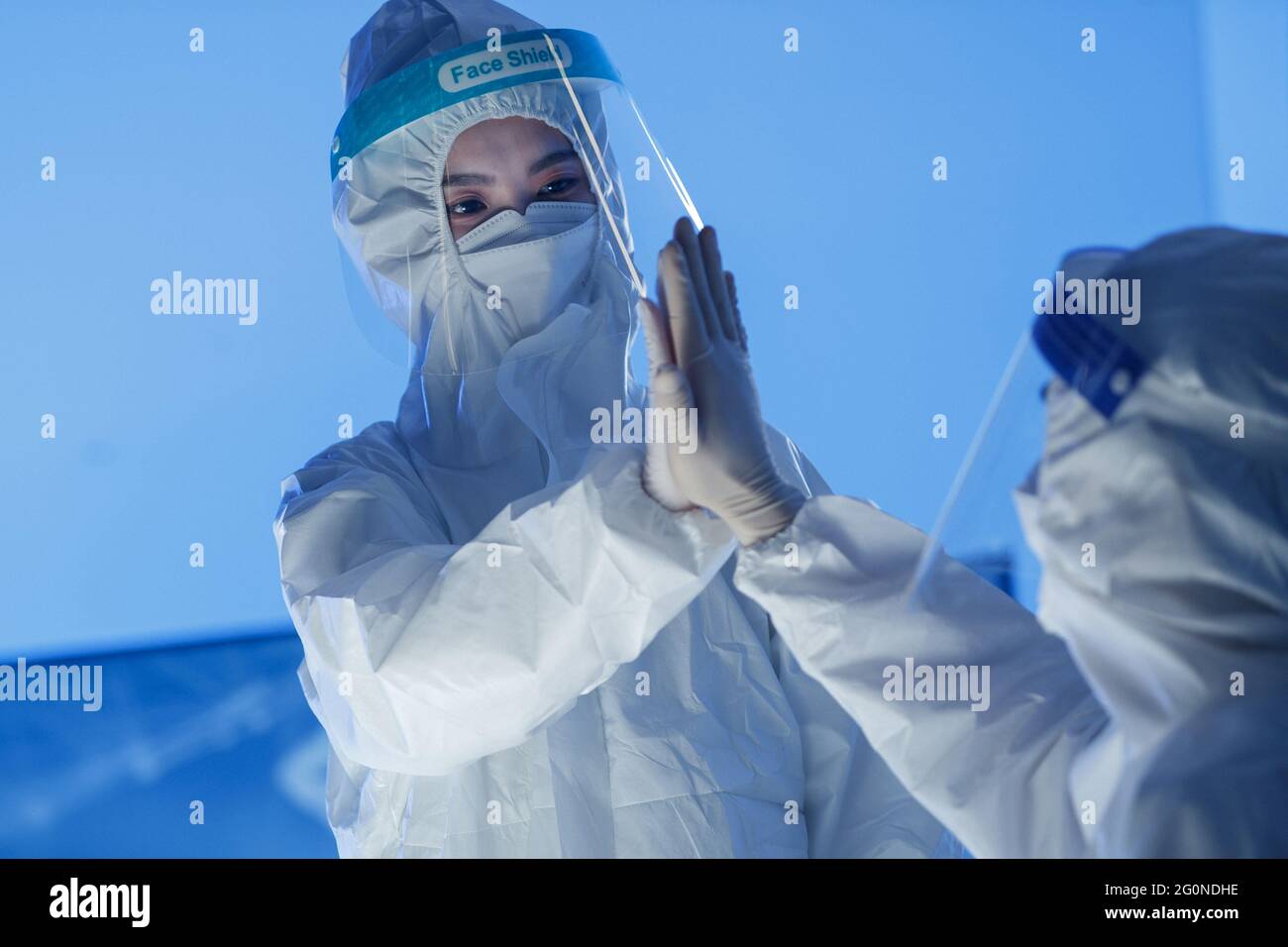 Wear protective clothing doctor mutual encouragement Stock Photo Alamy