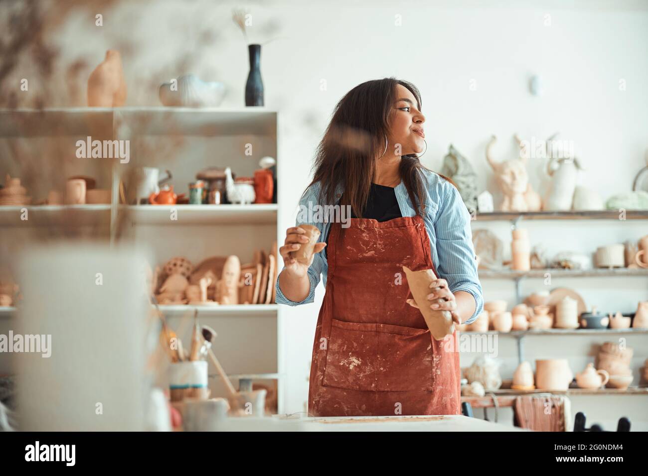 Charming woman in apron hi-res stock photography and images - Alamy