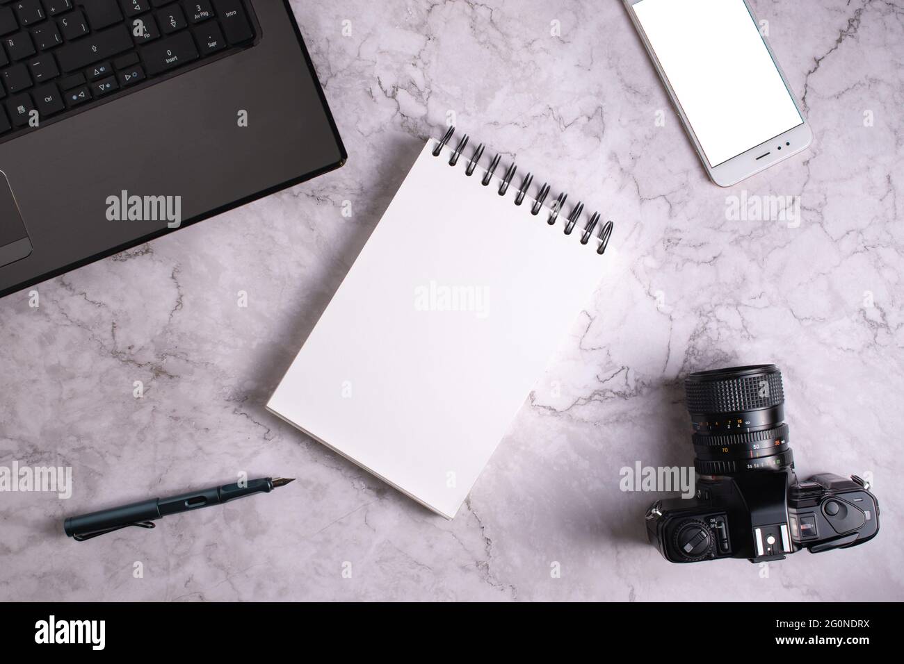 Composition of a computer, a camera, a smart phone and a notebook. Stock Photo